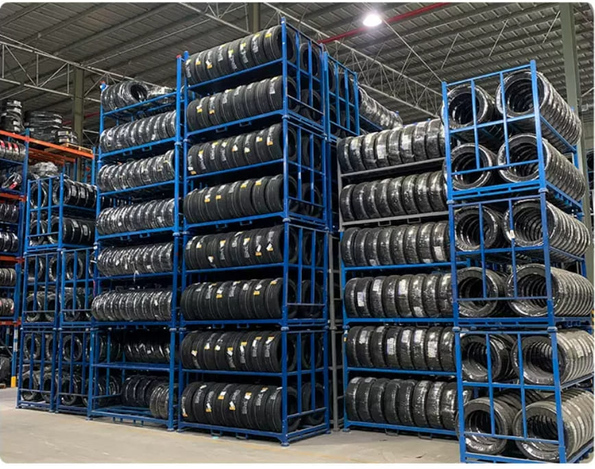 A well-organized warehouse with multiple tire storage racks.