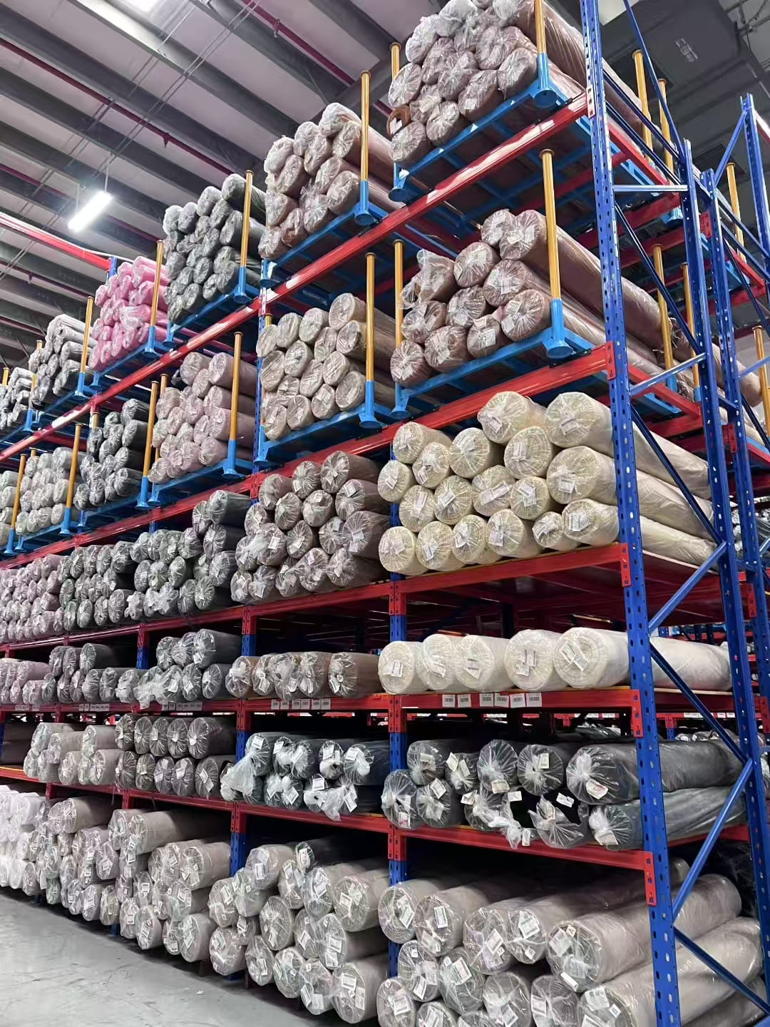 A warehouse utilizing stackable pallet racking to store goods vertically.