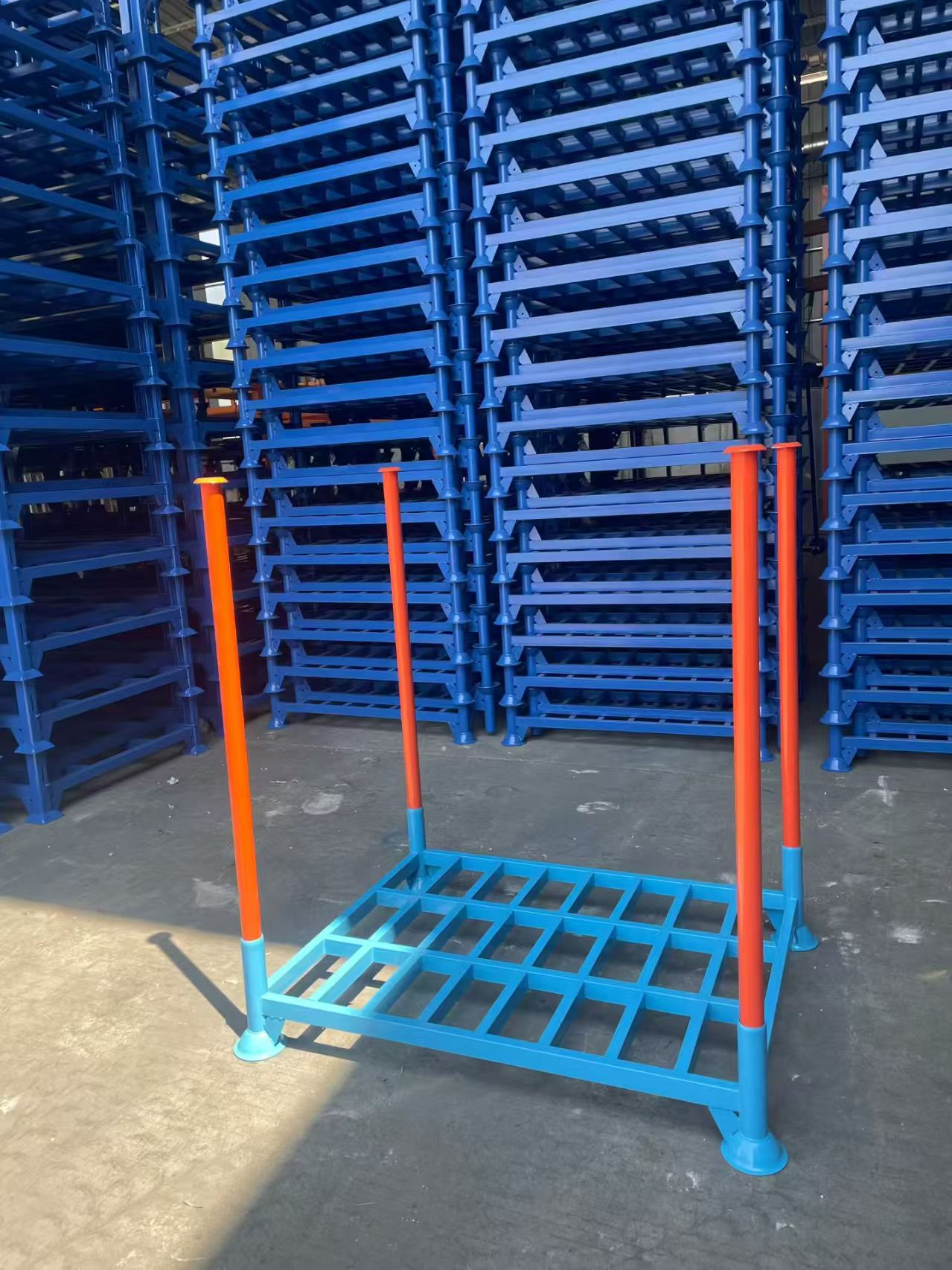 A variety of stackable pallet racks with different bases and finishes.