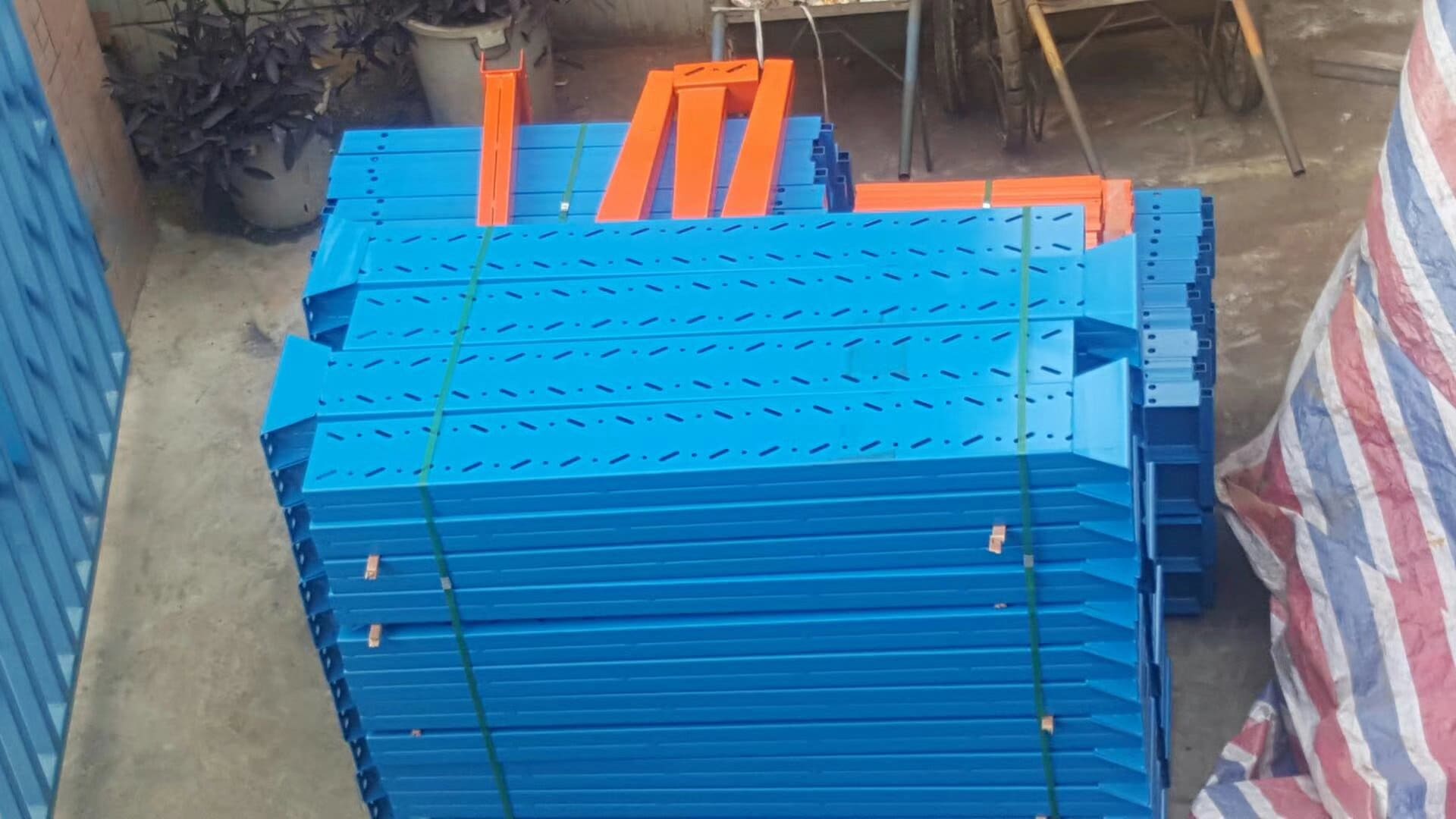 Tall cantilever racks in a warehouse reaching the ceiling