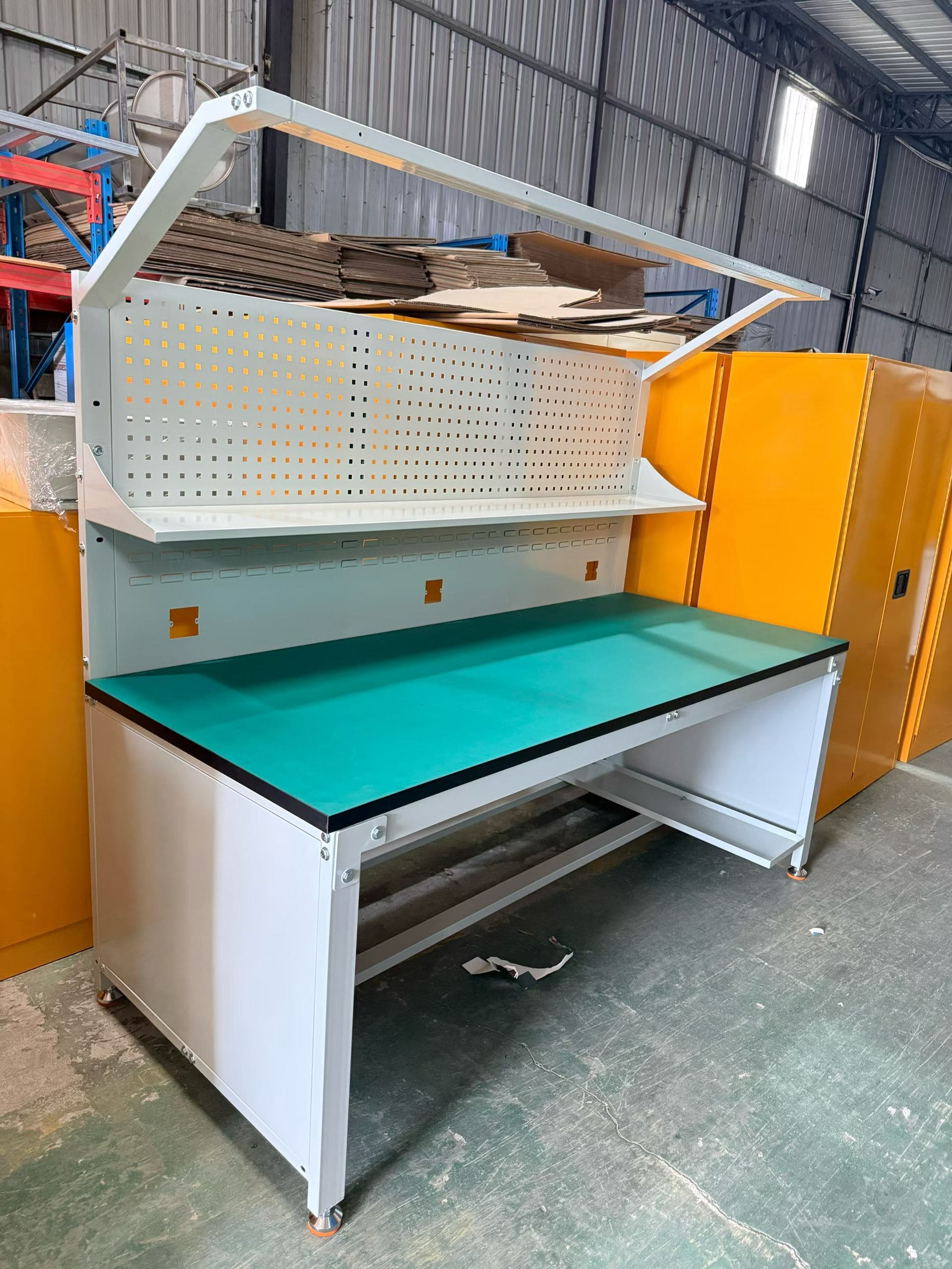 A heavy-duty industrial work table holding a large piece of machinery without bending.