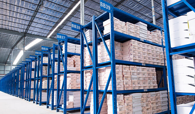A tidy workshop with tools and parts neatly organized on medium duty shelving units